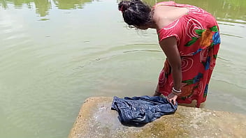 A married woman from a rural community engages in sexual activity with her husband in their private quarters, inviting a laundry worker to join them